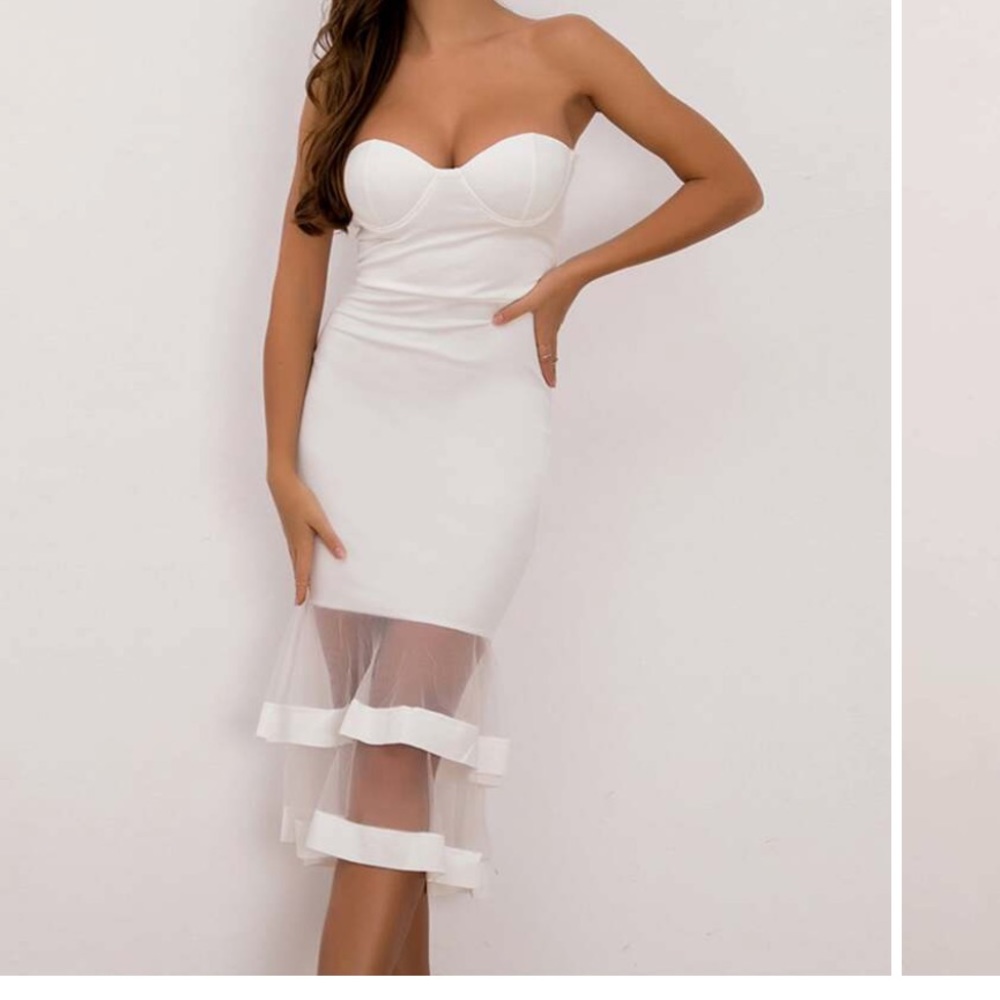 Strapless body hugging white dress with mesh stripes at hem. MIDI length